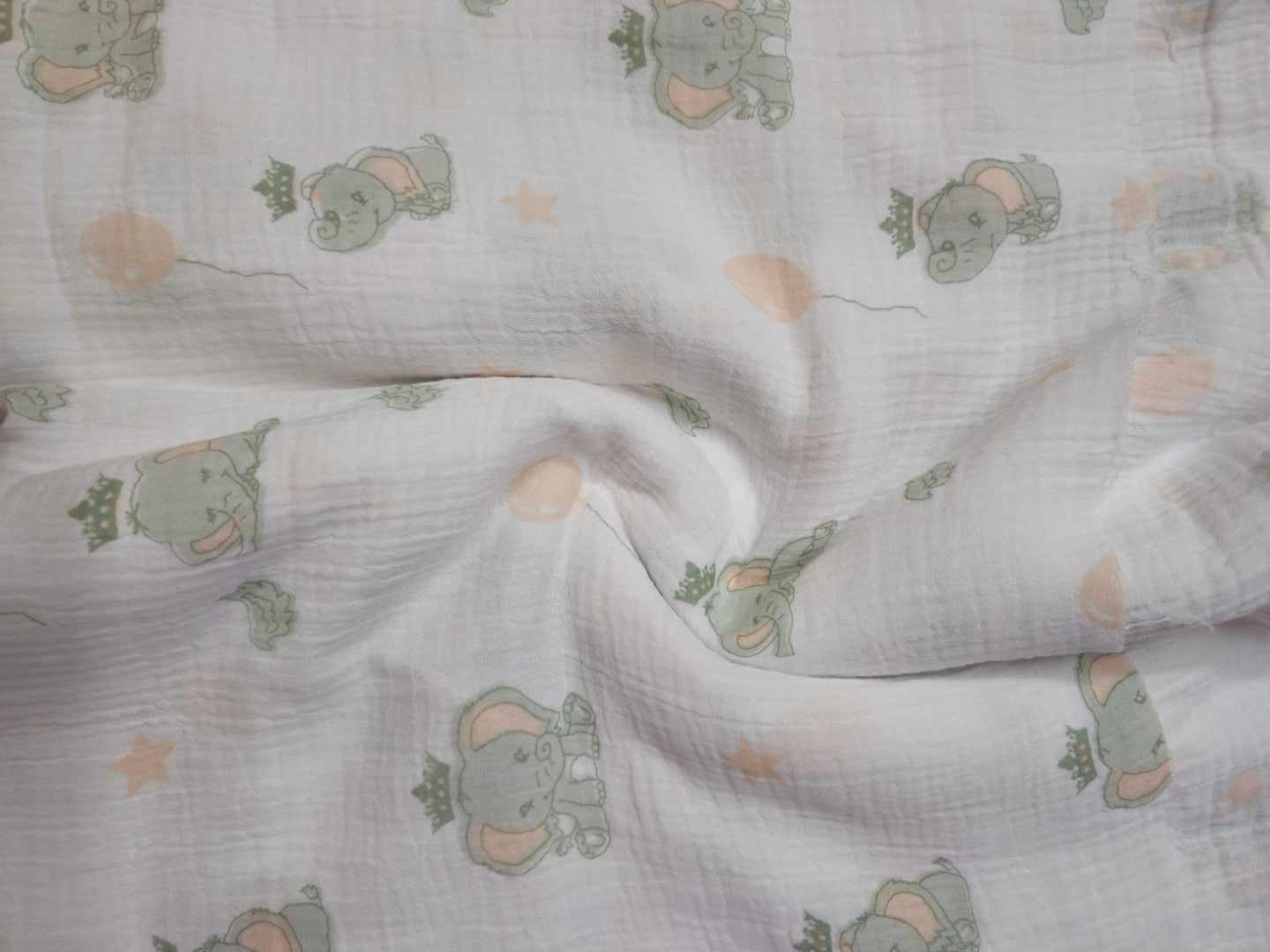 Double Gauze Muslin Fabric with elephant pattern on a light background