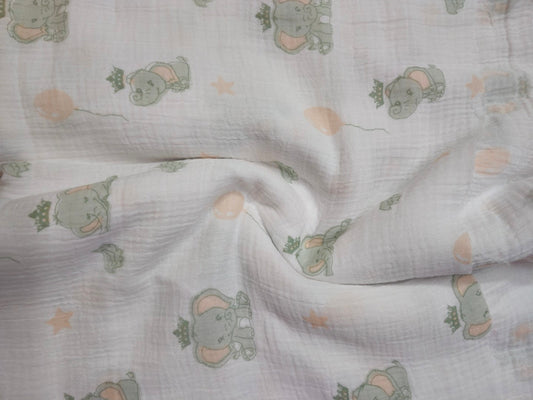 Double Gauze Muslin Fabric with elephant pattern on a light background